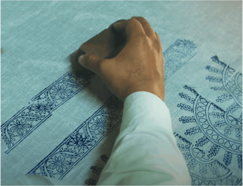 Hand printing intricate blue chikankari patterns