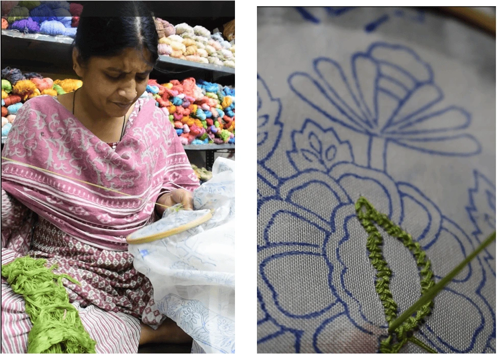 Woman embroidering intricate floral chikankari design.