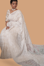 White colored silk organza saree with delicate tapechi embroidery and cutwork - Image 2