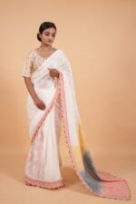 Cream color tapechi kota saree with multicolored pallu
