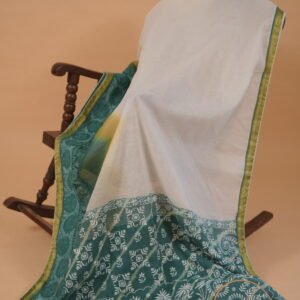 White embroidered saree with blue shade pallu