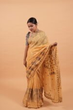 Yellow kota saree with cut work border and java highlighting in contrasting blue threadwork