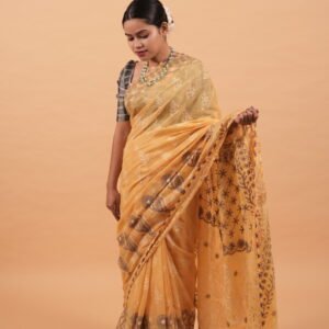 Yellow kota saree with cut work border and java highlighting in contrasting blue threadwork