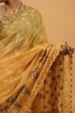 Yellow kota saree with cut work border and java highlighting in contrasting blue threadwork - Image 5