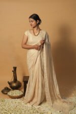 Cream kota saree with all over tapechi embroidery
