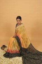 Yellow saree with black pallu shaded border in red and black