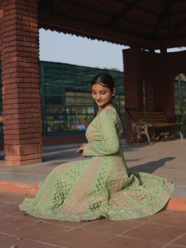 Woman in green traditional attire.