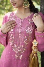 Woman in pink traditional attire