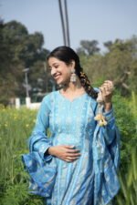 Woman in blue attire outdoors