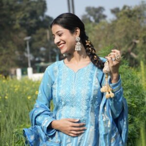 Woman in blue attire outdoors
