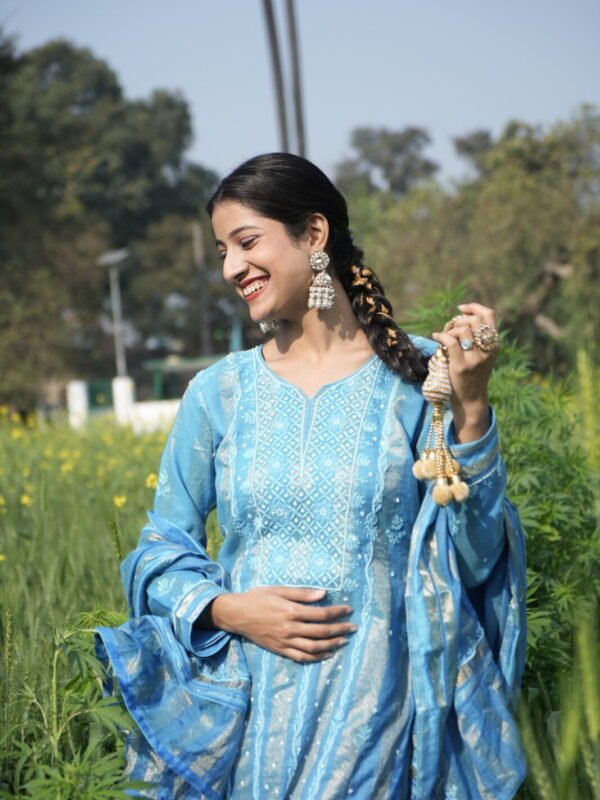 Woman in blue attire outdoors