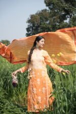 Woman in orange dress outdoors