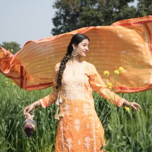 Woman in orange dress outdoors