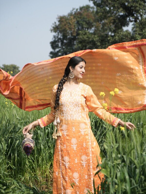 Woman in orange dress outdoors