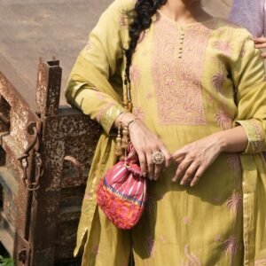 Woman in traditional attire with bag