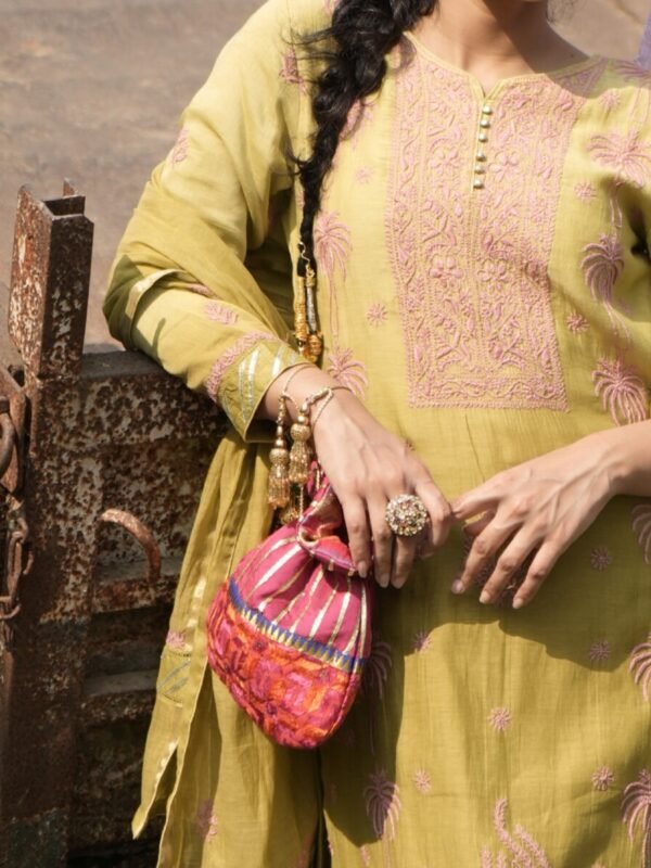 Woman in traditional attire with bag