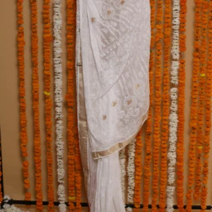 Ivory Cutwork Elegance Onam Kota Saree