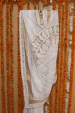 Ivory Java Cutwork Onam Kota Tapechi Saree