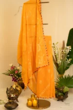 Orangish-Hued Saree with Leheriya Border.